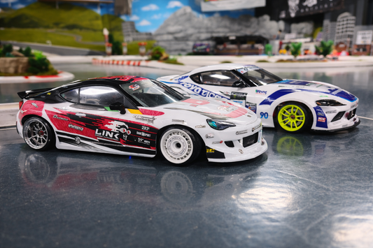 RC drift cars on track demonstrating controlled drifting technique