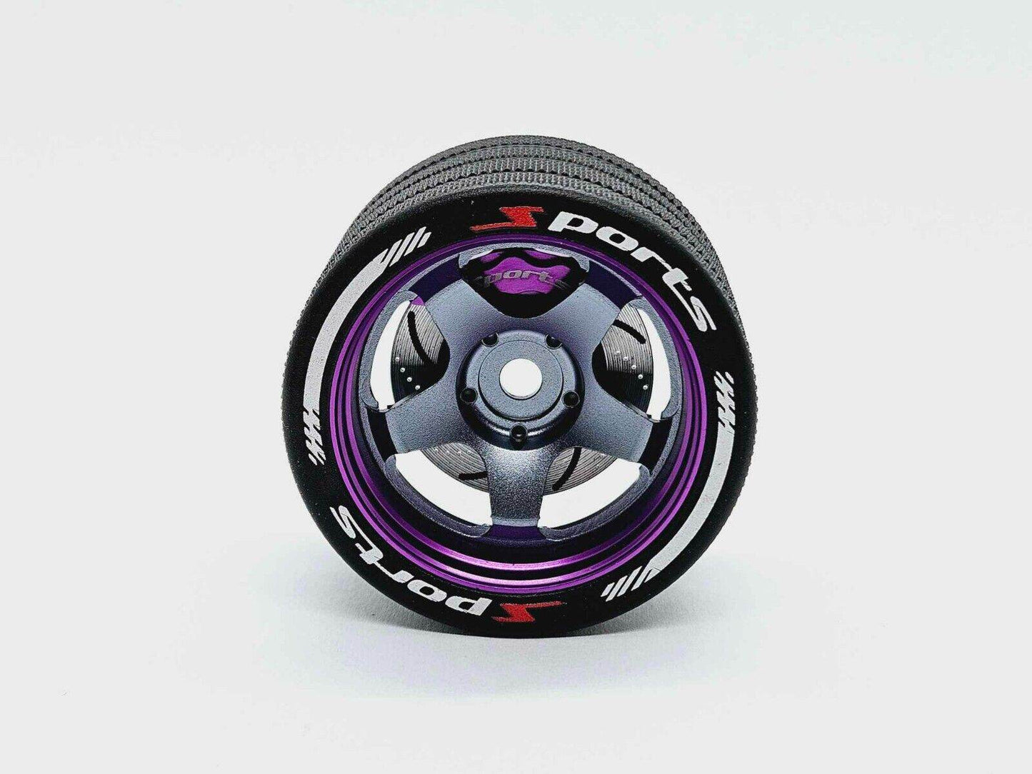 Close-up of the colorful RC transmitter steering wheel showing compatibility with major brands like SANWA, FUTABA, and FLYSKY