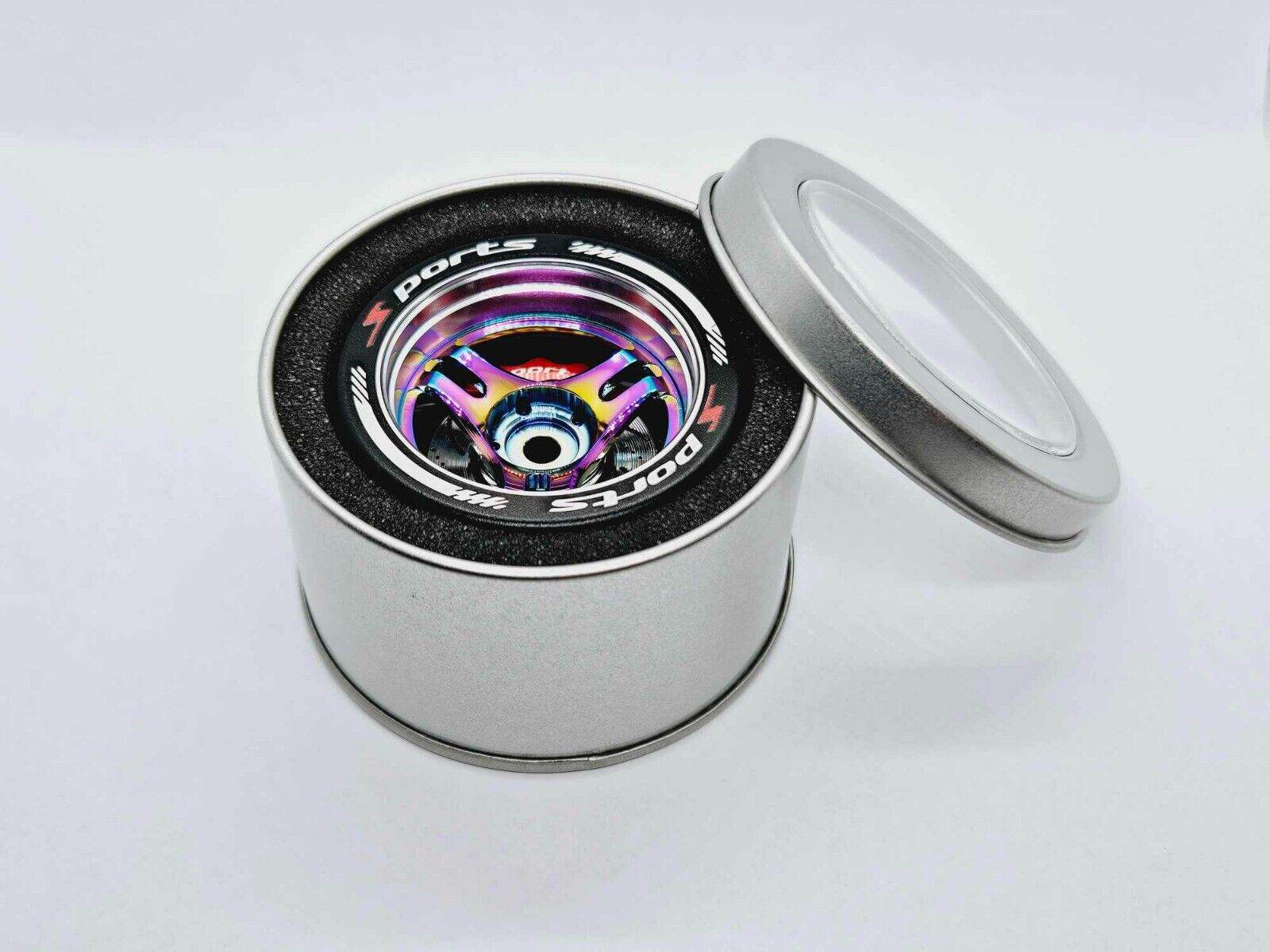 Close-up of the colourful RC transmitter steering wheel showing compatibility with major brands like SANWA, FUTABA, and FLYSKY