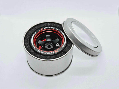 Close-up of the colorful RC transmitter steering wheel showing compatibility with major brands like SANWA, FUTABA, and FLYSKY