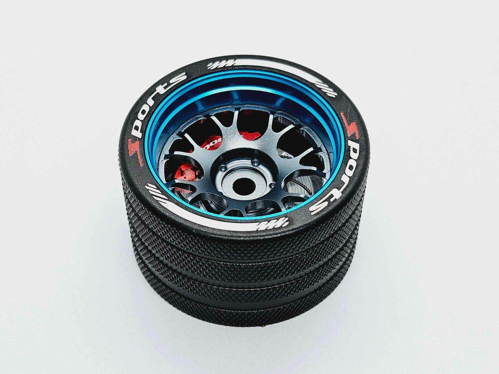Close-up of the colourful RC transmitter steering wheel showing compatibility with major brands like SANWA, FUTABA, and FLYSKY
blue