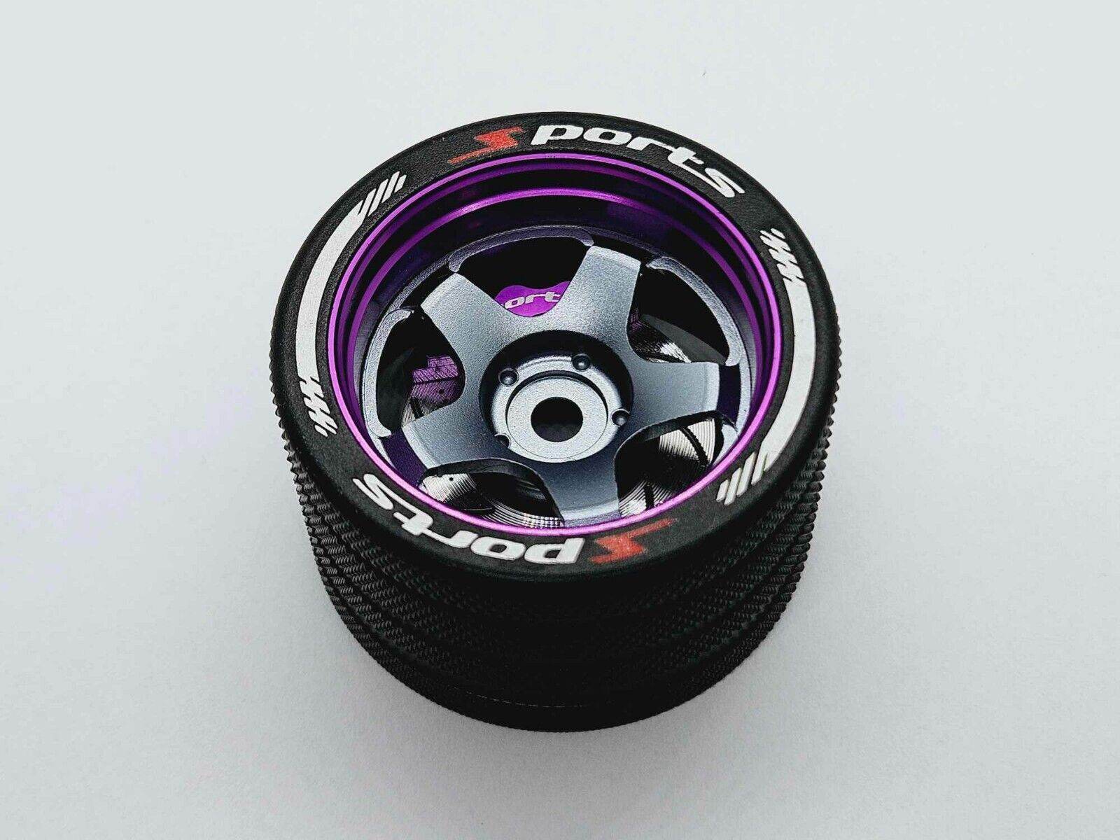 Close-up of the colorful RC transmitter steering wheel showing compatibility with major brands like SANWA, FUTABA, and FLYSKY