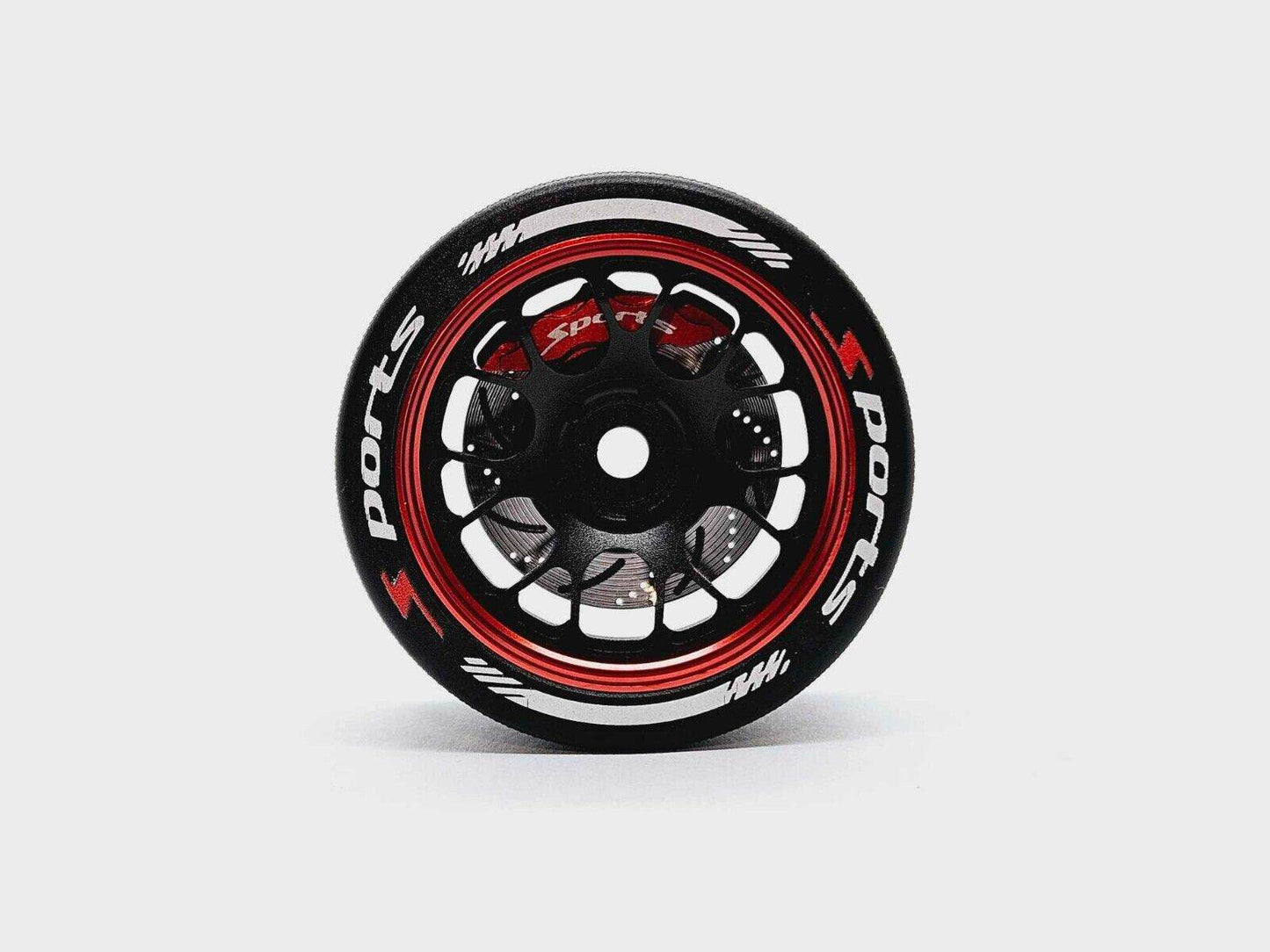 Close-up of the colourful RC transmitter steering wheel showing compatibility with major brands like SANWA, FUTABA, and FLYSKY
Red