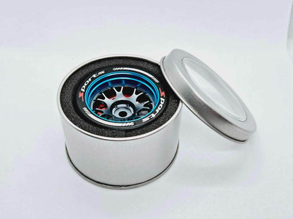 Close-up of the colourful RC transmitter steering wheel showing compatibility with major brands like SANWA, FUTABA, and FLYSKY
