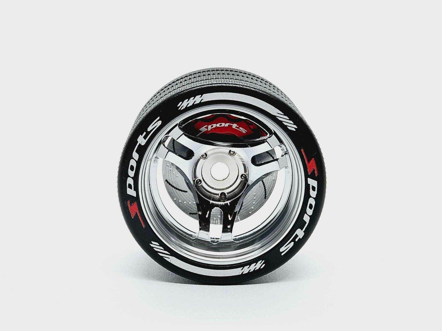 Close-up of the colourful RC transmitter steering wheel showing compatibility with major brands like SANWA, FUTABA, and FLYSKY