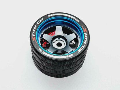 Close-up of the colorful RC transmitter steering wheel showing compatibility with major brands like SANWA, FUTABA, and FLYSKY