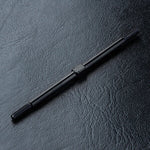 Close-up of MST Aluminium Turnbuckle 3x76mm in Red/Black #810016 for RC car suspension black