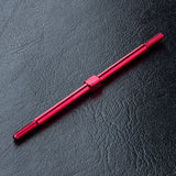 Close-up of MST Aluminium Turnbuckle 3x76mm in Red/Black #810016 for RC car suspension - red