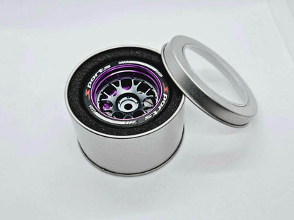 Close-up of the colourful RC transmitter steering wheel showing compatibility with major brands like SANWA, FUTABA, and FLYSKY
