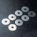 Close-up of MST 4x14x0.1 Spacer Set (8pcs) #310039 for accurate RC car alignment