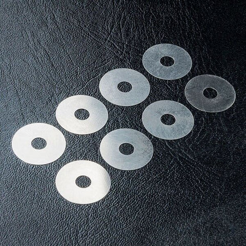 Close-up of MST 4x14x0.1 Spacer Set (8pcs) #310039 for accurate RC car alignment