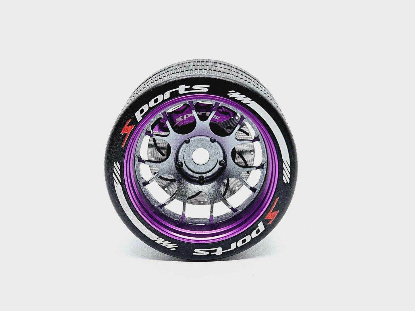 Close-up of the colourful RC transmitter steering wheel showing compatibility with major brands like SANWA, FUTABA, and FLYSKY
Purple