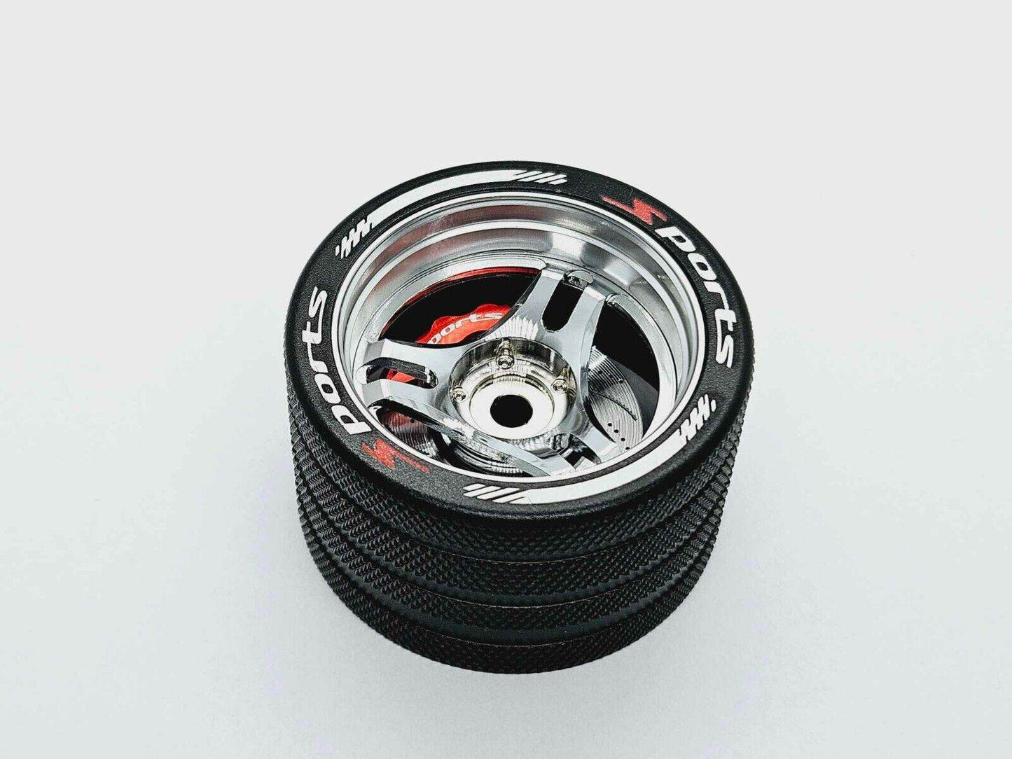 Close-up of the colourful RC transmitter steering wheel showing compatibility with major brands like SANWA, FUTABA, and FLYSKY