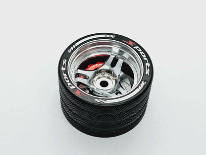 Close-up of the colourful RC transmitter steering wheel showing compatibility with major brands like SANWA, FUTABA, and FLYSKY