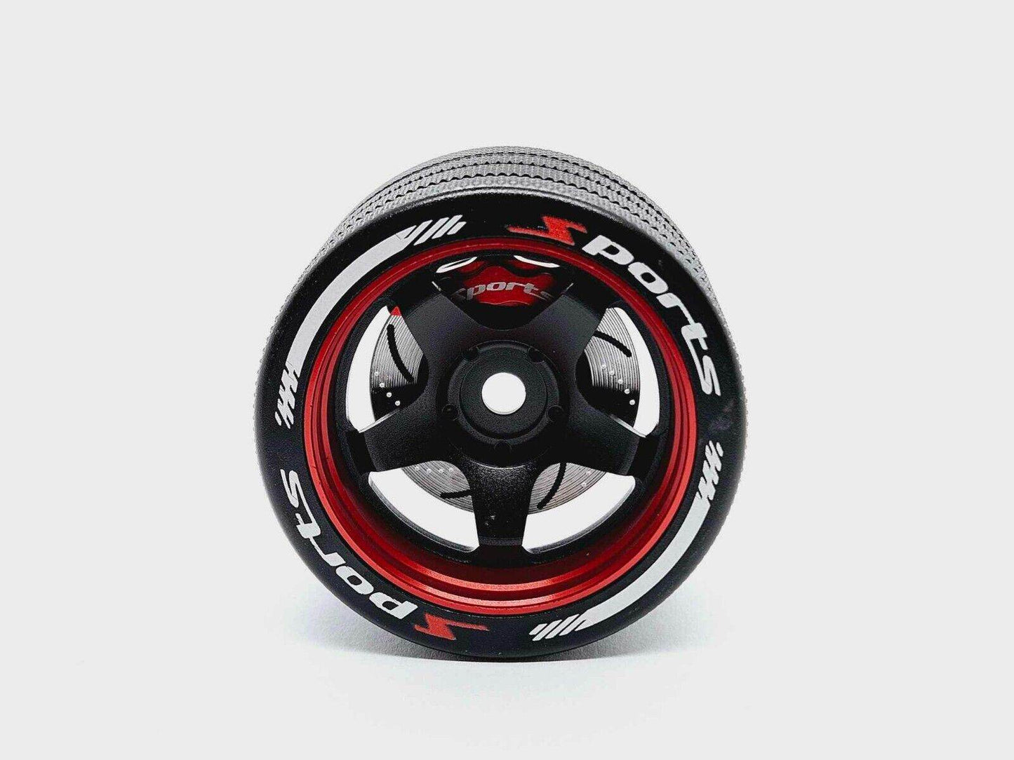 Close-up of the colorful RC transmitter steering wheel showing compatibility with major brands like SANWA, FUTABA, and FLYSKY