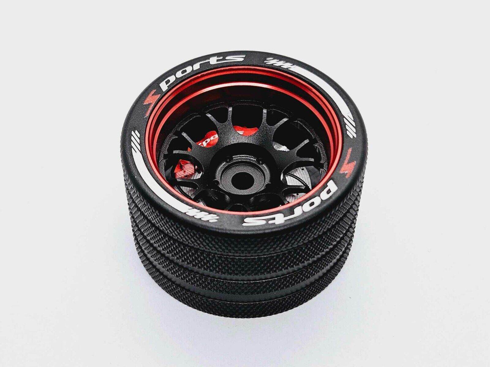 Close-up of the colourful RC transmitter steering wheel showing compatibility with major brands like SANWA, FUTABA, and FLYSKY
