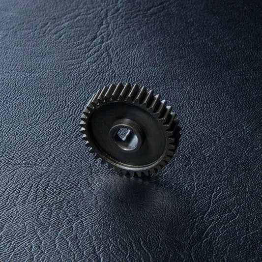 Close-up of MST FXX Transmission Plastic Gear C 36T #210350 for RC models 210350