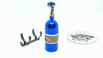 Close-up of aluminium 1/10 scale RC NOS bottle, designed as a balance weight for enhanced vehicle stability - blue