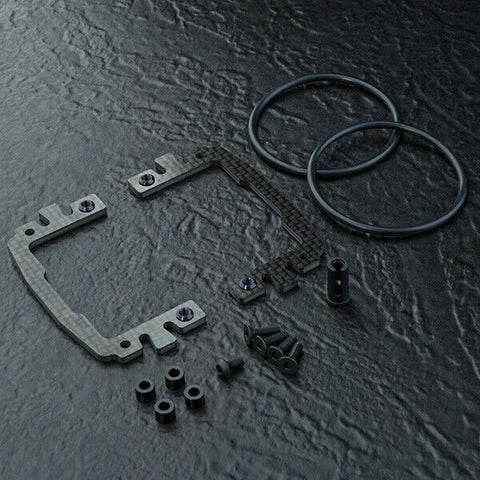 Close-up of MST Carbon Fibre Battery Mount Set, enhancing battery stability and performance, #210641