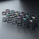 Close-up of MST DK Coil Spring Set 26-28mm, 6 Sets #820157 for precise RC suspension adjustments