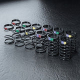 Close-up of MST DK Coil Spring Set 26-28mm, 6 Sets #820157 for precise RC suspension adjustments