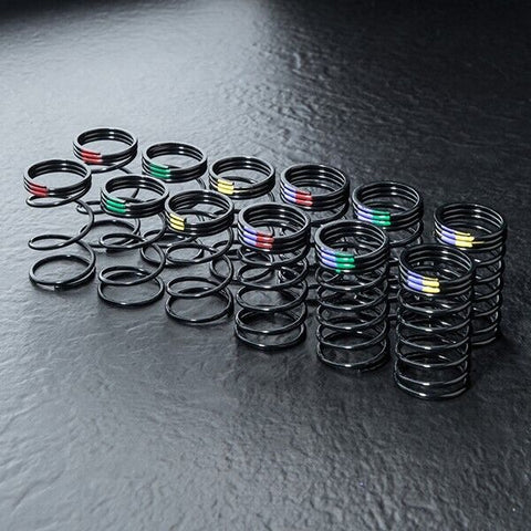 Close-up of MST DK Coil Spring Set 26-28mm, 6 Sets #820157 for precise RC suspension adjustments