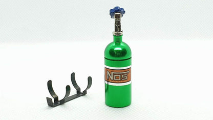 Close-up of aluminium 1/10 scale RC NOS bottle, designed as a balance weight for enhanced vehicle stability - green
